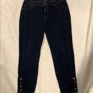 Dark blue crop jeans with ankle button detail